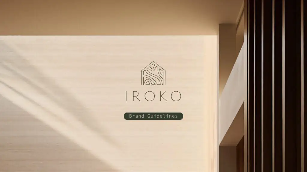 The Real Estate branding logo for iroko is shown on a wall.