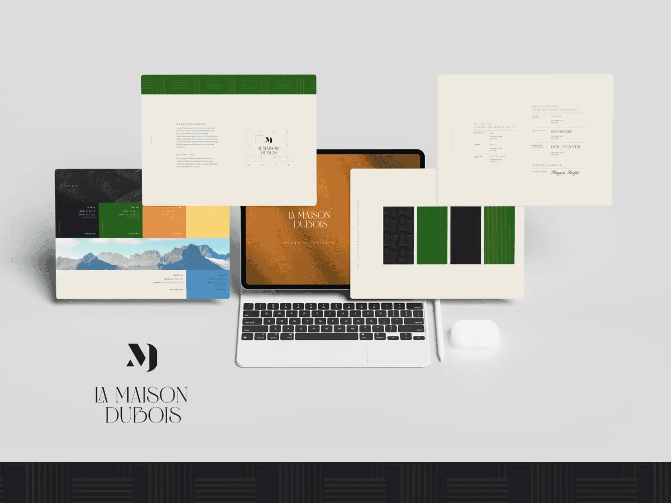 Corporate-Branding-Materialien für „La Maison Dubois“, einschließlich Website auf Laptop-Bildschirm, Broschüren, Visitenkarten und Briefkopf, entworfen und angeordnet auf einem neutralen Hintergrund.
